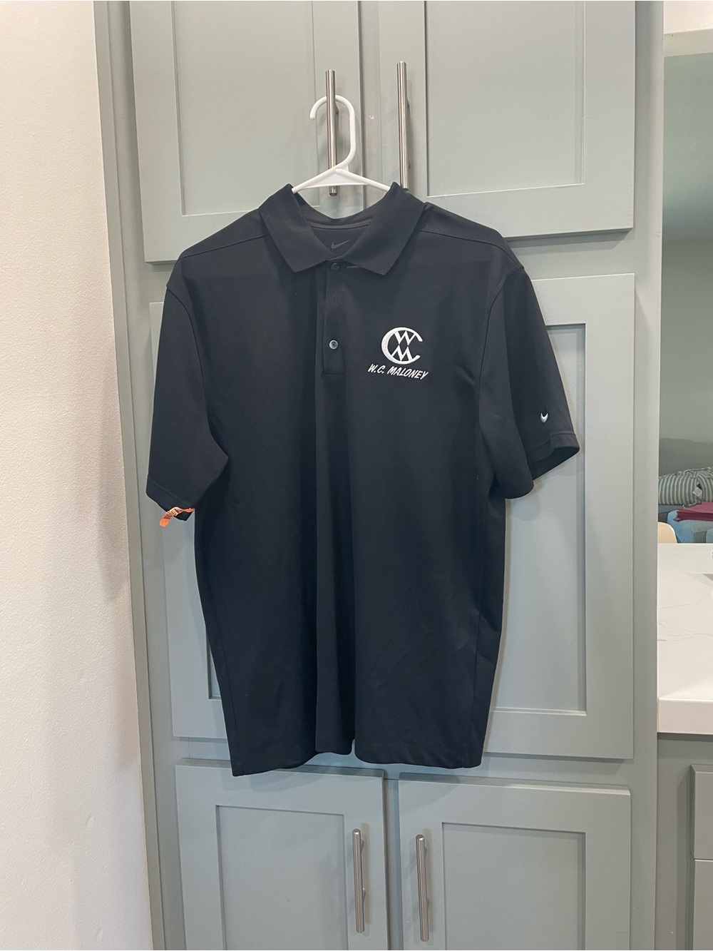 Nike Black Polo with White Chest Emblem